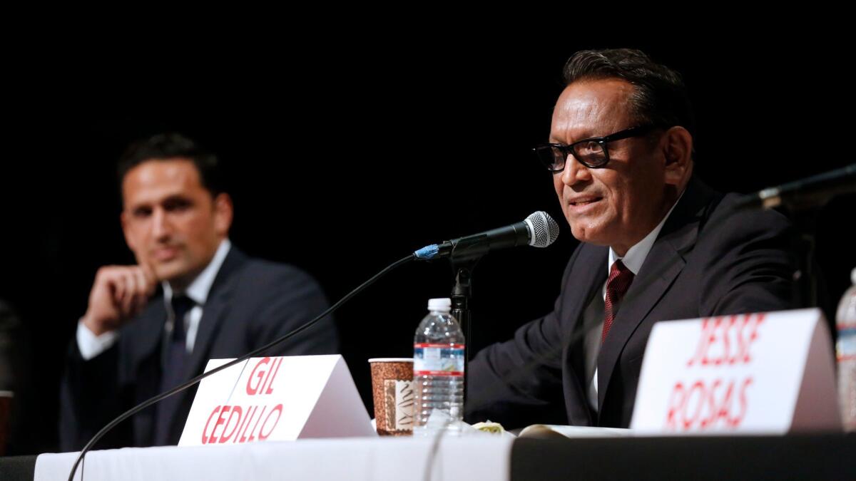 Challenger Joe Bray-Ali, left, and incumbent Gil Cedillo discuss issues earlier this month at a forum for City Council District 1 candidates.