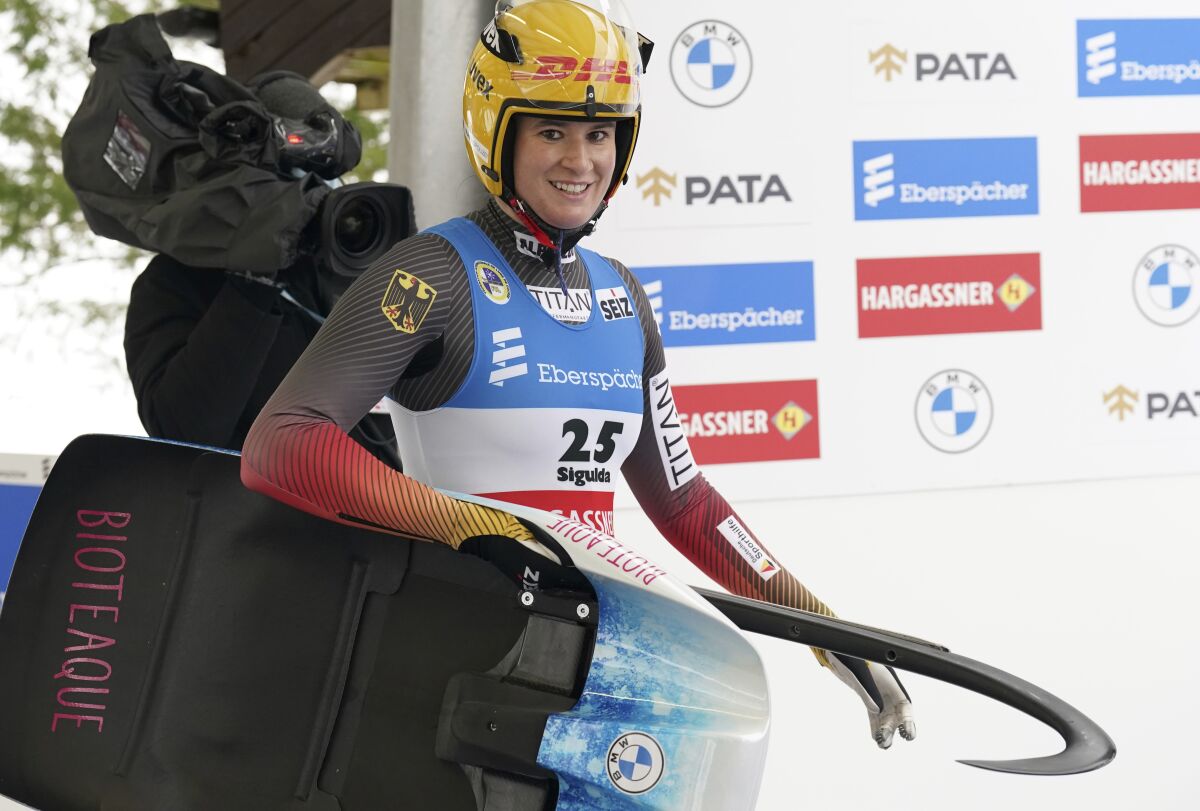 Natalie Geisenberger of Germany smiles after her second run of the Luge World Cup women race in Sigulda, Latvia, Sunday, Jan. 9, 2022. (AP Photo/Roman Koksarov)
