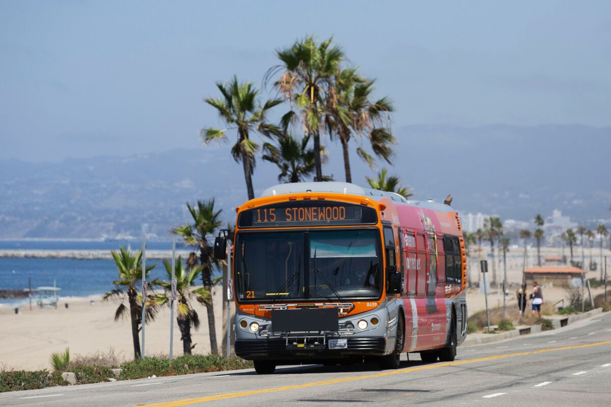 A Metro bus on Route 115 drives down Vista Del Mar past Dockweiler Beach in Playa Del Rey.