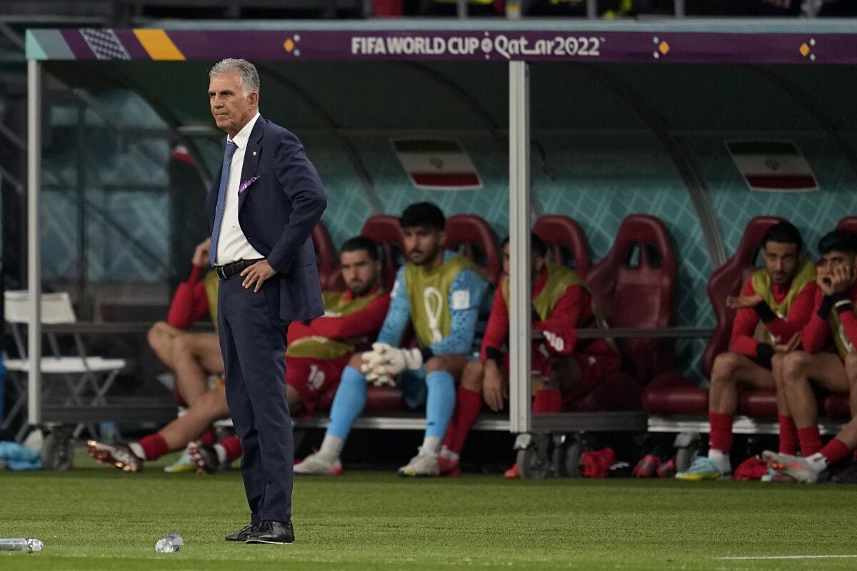 Iran's head coach Carlos Queiroz watches during the World Cup group B match between England and Iran.