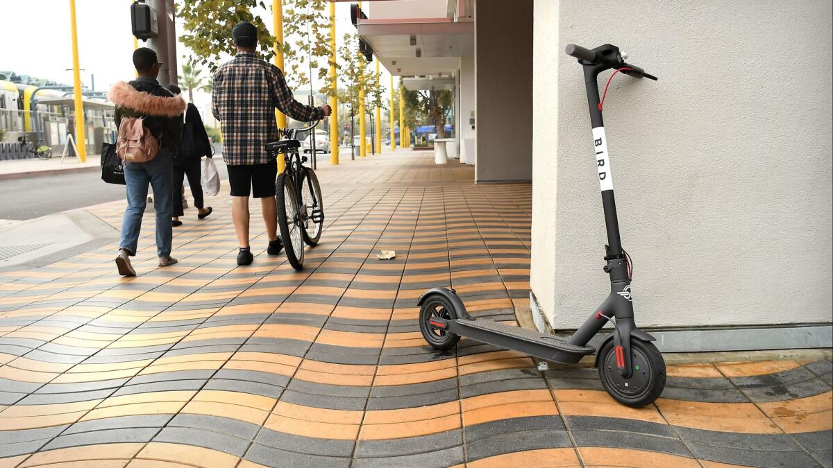 A Bird scooter awaits its next rider at Colorado Avenue and 5th Street in Santa Monica. The firm ran into legal trouble with the city, which said it failed to secure proper business licenses.