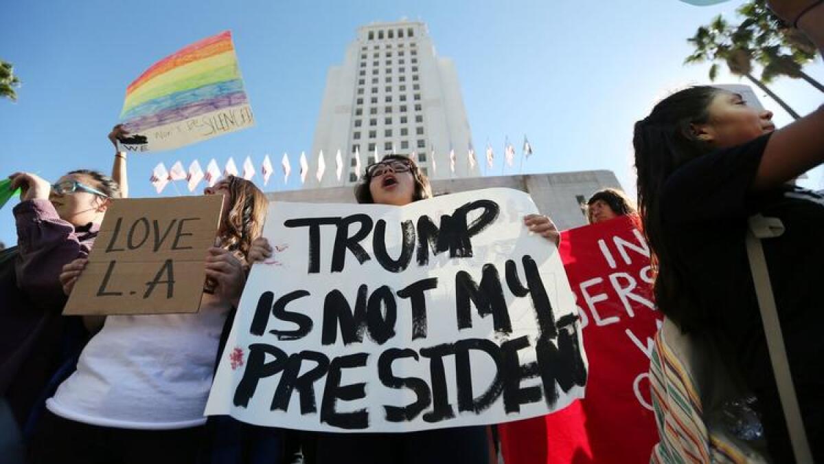 Students from several high schools rally at City Hall in downtown Los Angeles on Nov. 14 after walking out of class to protest the election of Donald Trump.