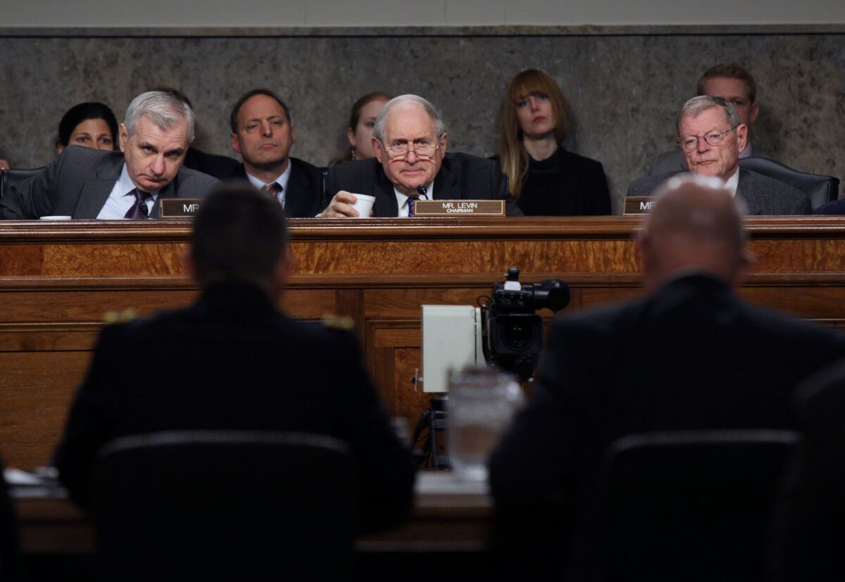 Sen. Carl Levin (D-Mich.), center, chairs a Senate Armed Services Committee meeting Tuesday. He tried without luck last week to broaden congressional oversight of lethal overseas drone strikes.
