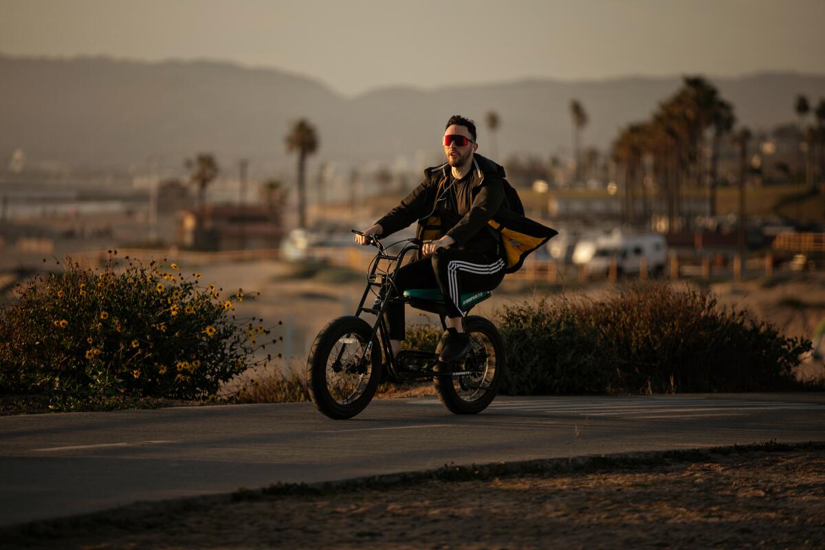 A man enjoys a bike ride.