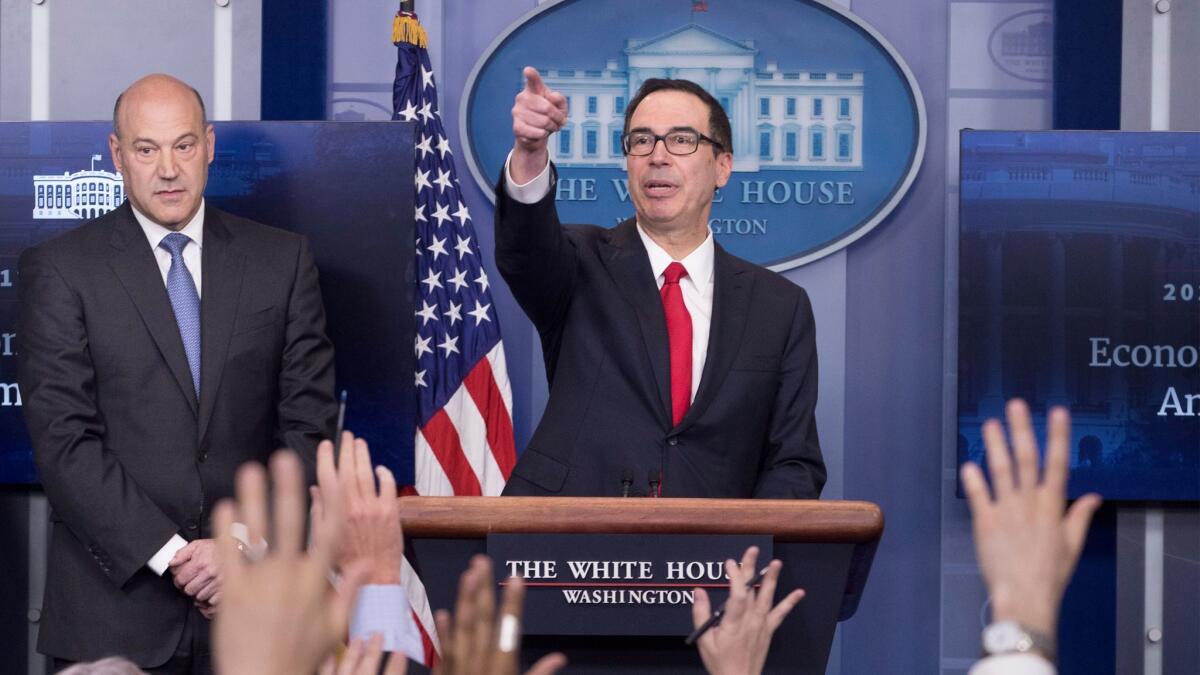 National Economic Director Gary Cohn, left, and Treasury Secretary Steven T. Mnuchin answer reporters' questions about President Trump's tax plan in April. (Michael Reynolds / European Pressphoto Agency)