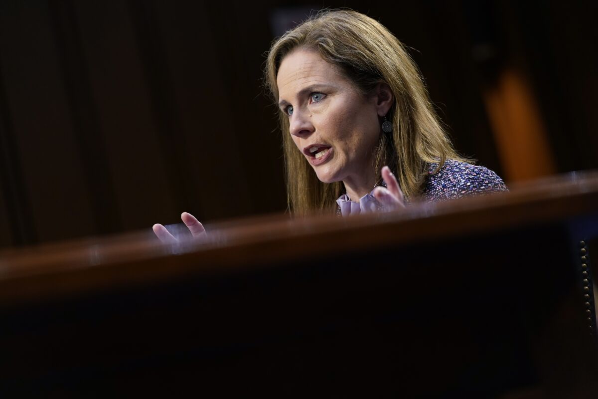 FILE - Supreme Court nominee Amy Coney Barrett speaks during a confirmation hearing before the Senate Judiciary Committee, Oct. 14, 2020, on Capitol Hill in Washington. In one form or another, every Supreme Court nominee is asked during Senate hearings about his or her views of the landmark abortion rights ruling that has stood for a half century. Now, a draft opinion obtained by Politico suggests that a majority of the court is prepared to strike down the Roe v. Wade decision from 1973, leaving it to the states to determine a woman’s ability to get an abortion. (AP Photo/Susan Walsh, Pool, File)