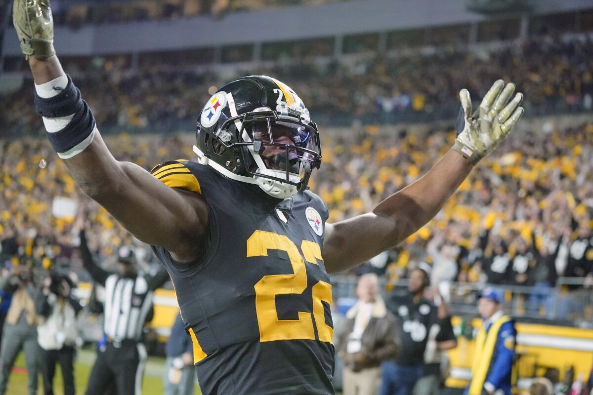 Pittsburgh Steelers running back Najee Harris (22) celebrates after scoring a touchdown against the Chicago Bears in the first half of an NFL football game, Monday, Nov. 8, 2021, in Pittsburgh. (AP Photo/Gene J. Puskar)