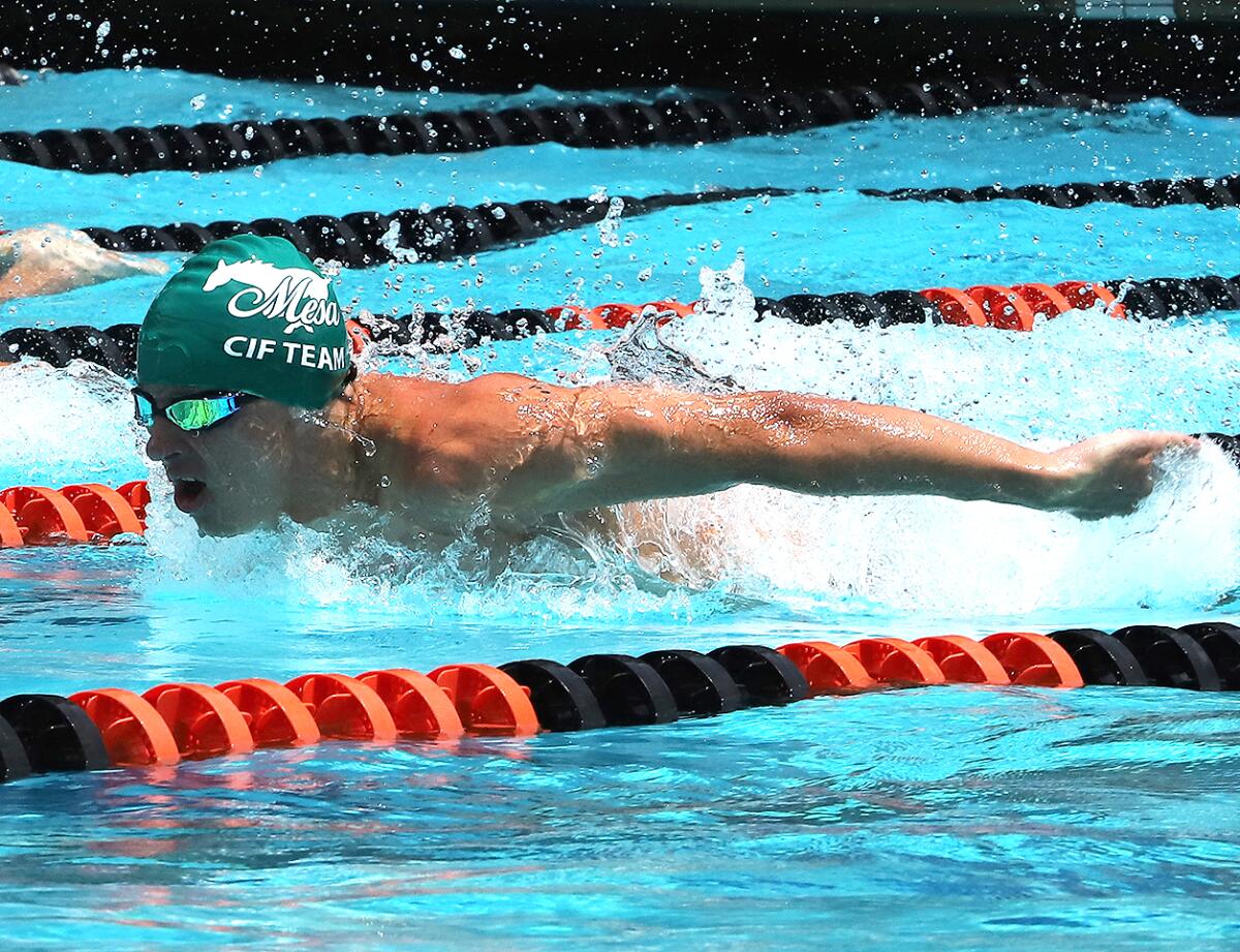 Costa Mesa's Avrum Xagorarakis competes in the Division 3 boys' 100 yard butterfly on Saturday at Riverside City College.