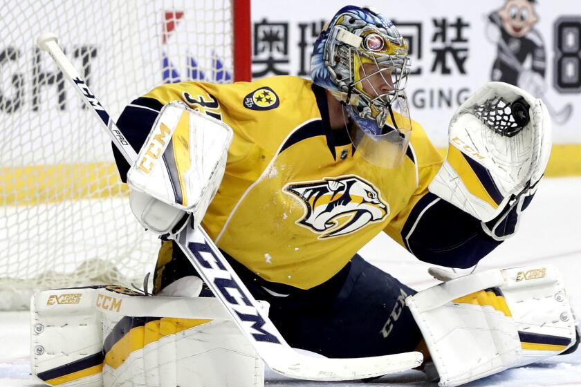 Nashville Predators goalie Pekka Rinne, of Finland, gloves a Chicago Blackhawks shot during the third period in Game 4 of a first-round NHL hockey playoff series Thursday, April 20, 2017, in Nashville, Tenn. Rinne stopped 30 shots as the Predators won 4-1, sweeping the series. (AP Photo/Mark Humphrey)