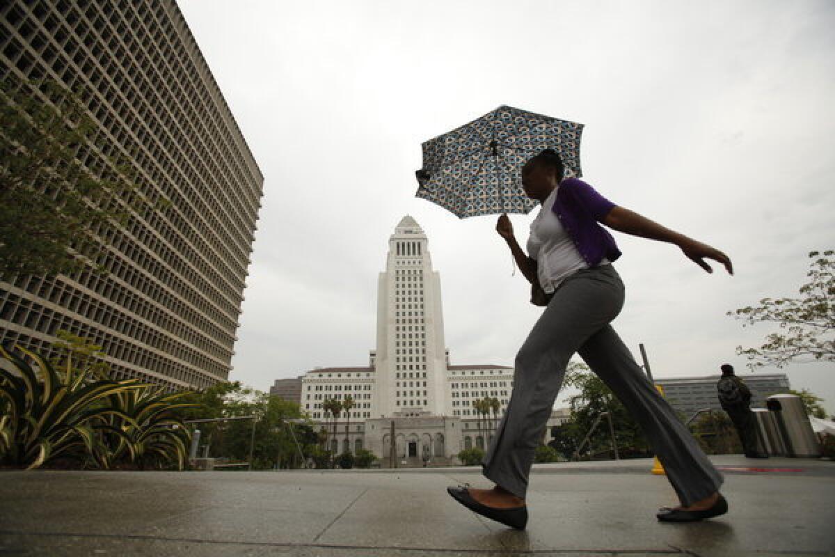An unusual summer rain made for a wet walk in downtown Los Angeles.