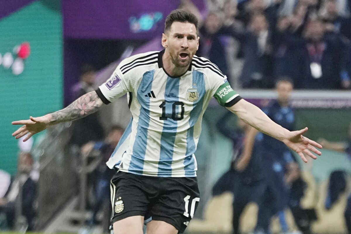 Argentina's Lionel Messi celebrates after scoring his side's opening goal. 