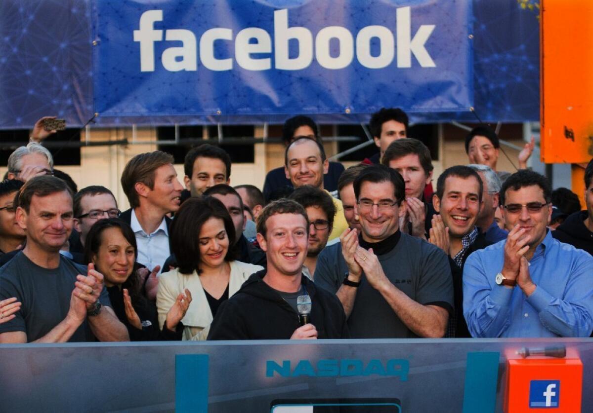 Facebook founder Mark Zuckerberg, center, rings the Nasdaq opening bell May 18 from Facebook headquarters in Menlo Park, Calif.
