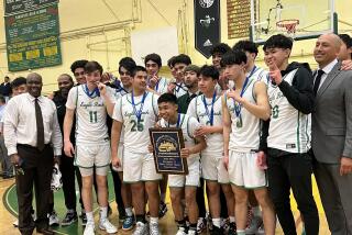 Eagle Rock celebrates winning the City Section Division II championship with 53-49 win over South Gate.