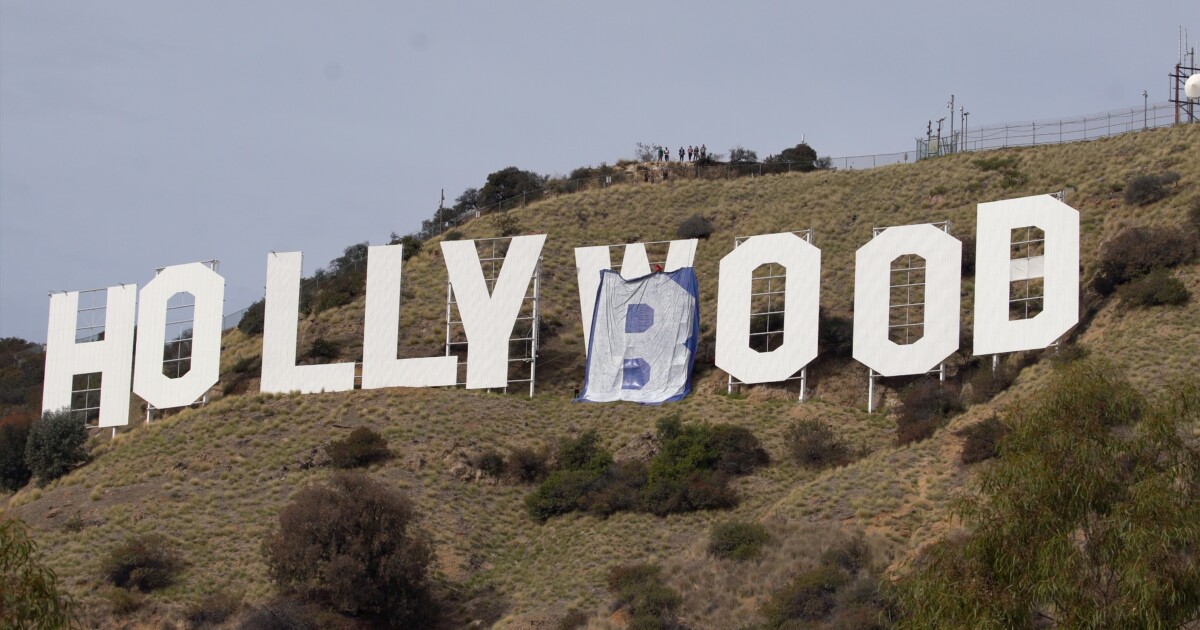 They decided to make it the 'Hollyboob' sign because of Instagram 'censorship' They decided to make it the 'Hollyboob' sign because of Instagram 'censorship'