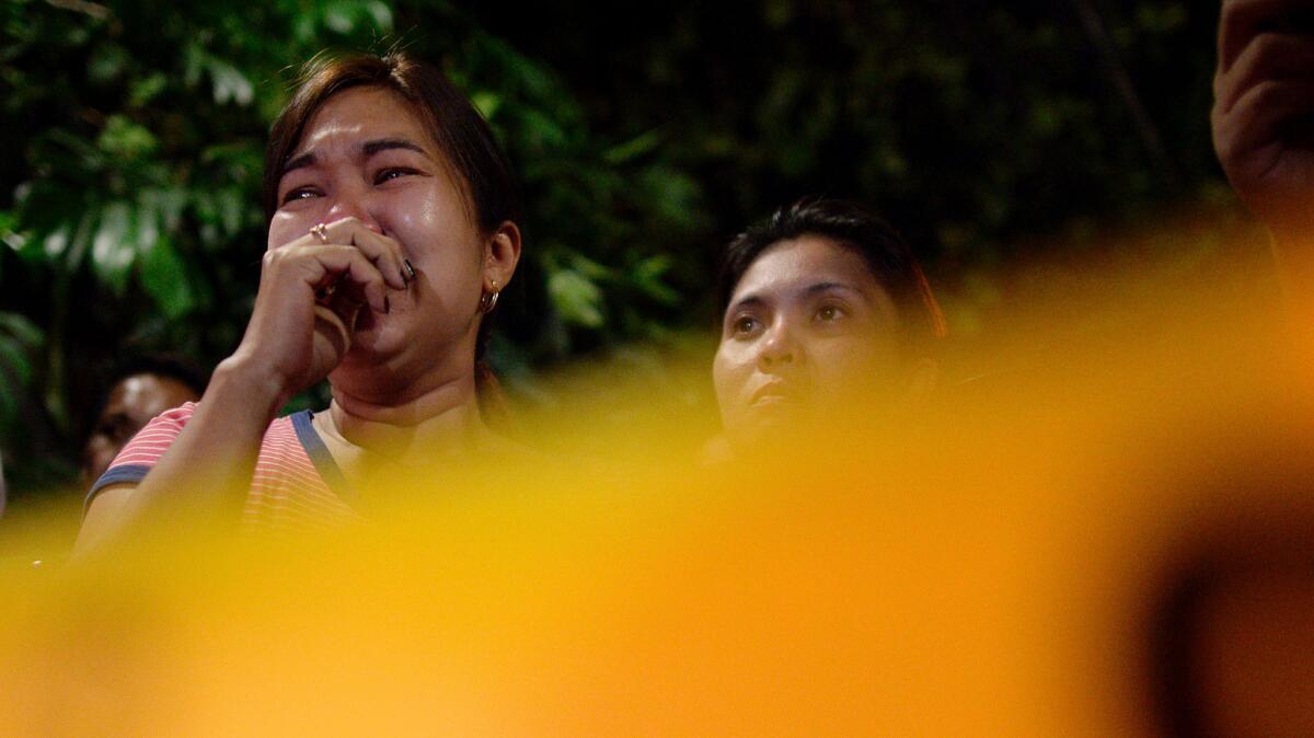 Relatives of a tricycle driver shown grieving after he was killed in July by an unidentified gunman for being a suspected drug dealer.