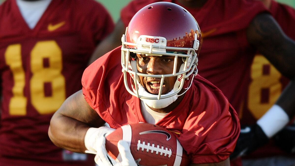 USC wide receiver Darreus Rogers carries the ball during a team practice session in August.