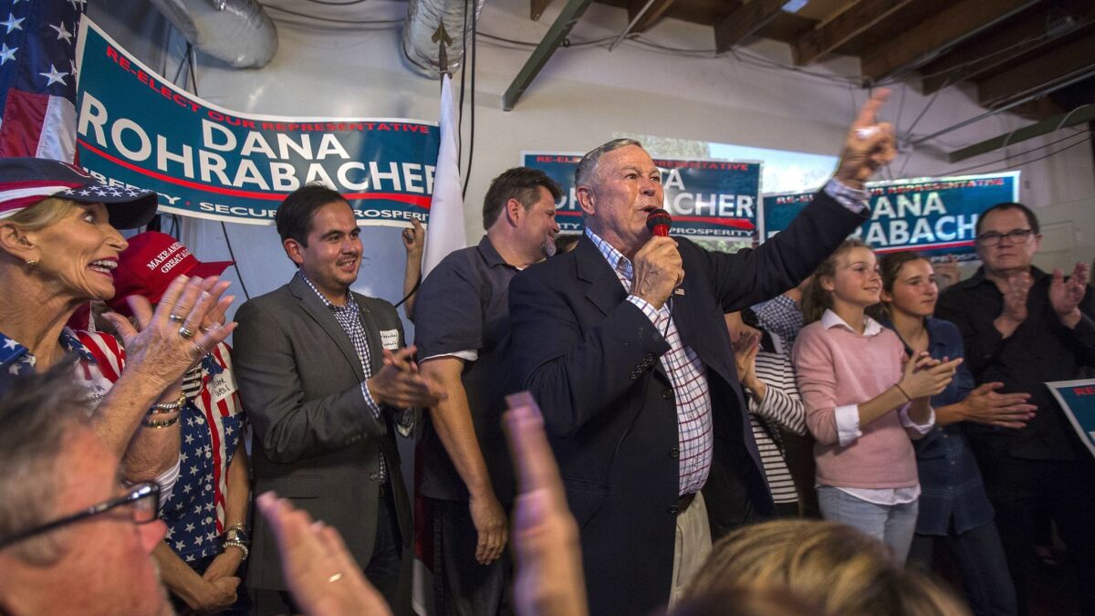 Republican Rep. Dana Rohrabacher celebrates with supporters on Tuesday night at his campaign headquarters in Costa Mesa.
