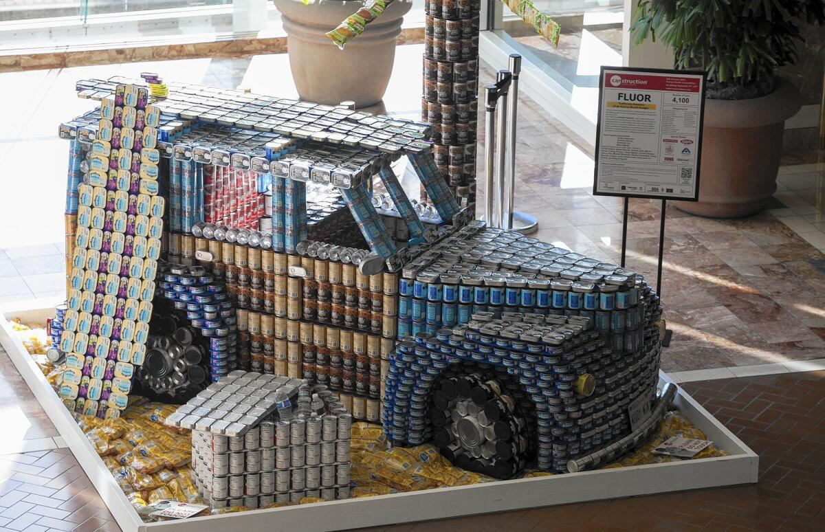 Fluor's "California Dreamin' of an End to World Hunger," made with 4,100 cans, won the Juror's Favorite award during Canstruction at South Coast Plaza on Friday. The cans of food used to build structures in the mall are then donated to the Orange County Food Bank.