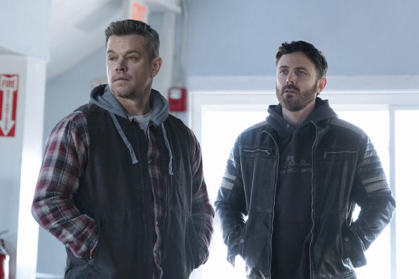This image released by Apple TV shows Matt Damon, left, and Casey Affleck in a scene from "The Instigators." (Apple TV+ via AP)