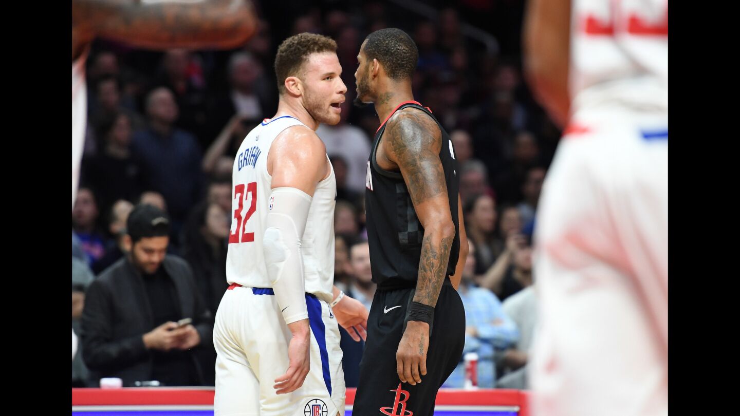 Clippers' Blake Griffin, left, and Houston Rockets' Trevor Ariza are ejected from the game after having a few words.