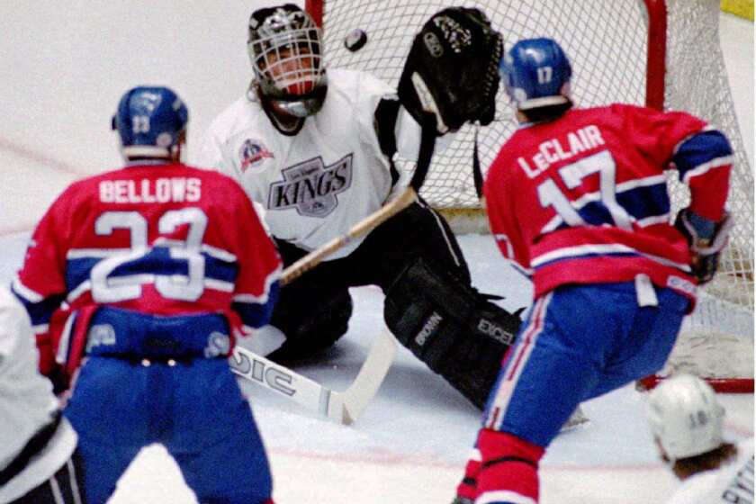 Kings goalie Kelly Hrudey stops a shot by Montreal's John LeClair, right, as teammate Brian Bellows looks on during the first period of Game 4 of the Stanley Cup Final. LeClair scored the winning goal in overtime to lift Montreal to a 3-2 win in the first-ever Stanley Cup final game to be played in Los Angeles.