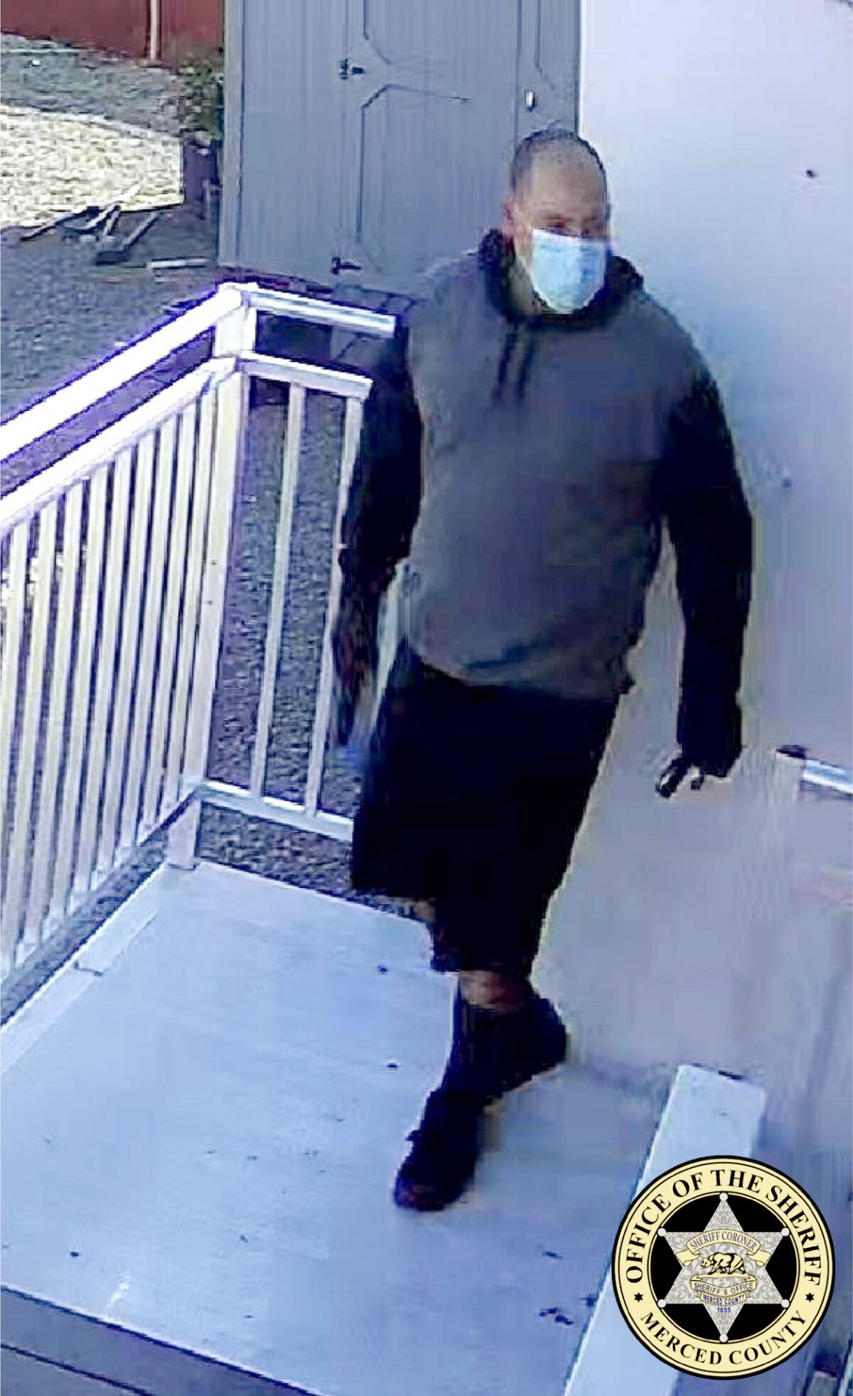 Photo provided by the Merced County Sheriff's office shows surveillance footage of a man in a face mask.