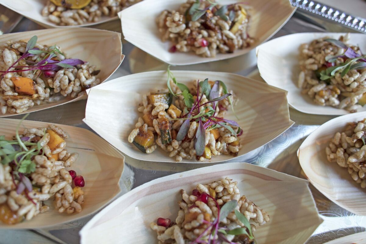 Adya serves a vegan dish — a mixed-squash chaat with tamarind, puffed rice and pomegranate.