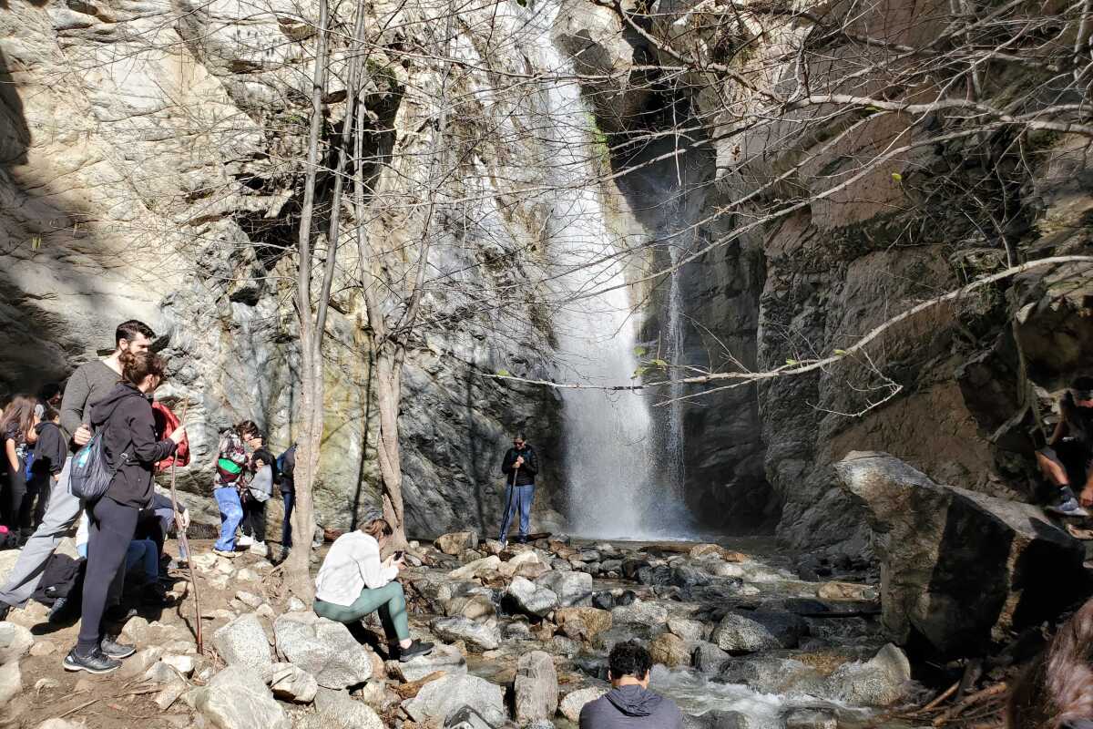 Hikers near the waterfall at Millard Canyon Falls. 