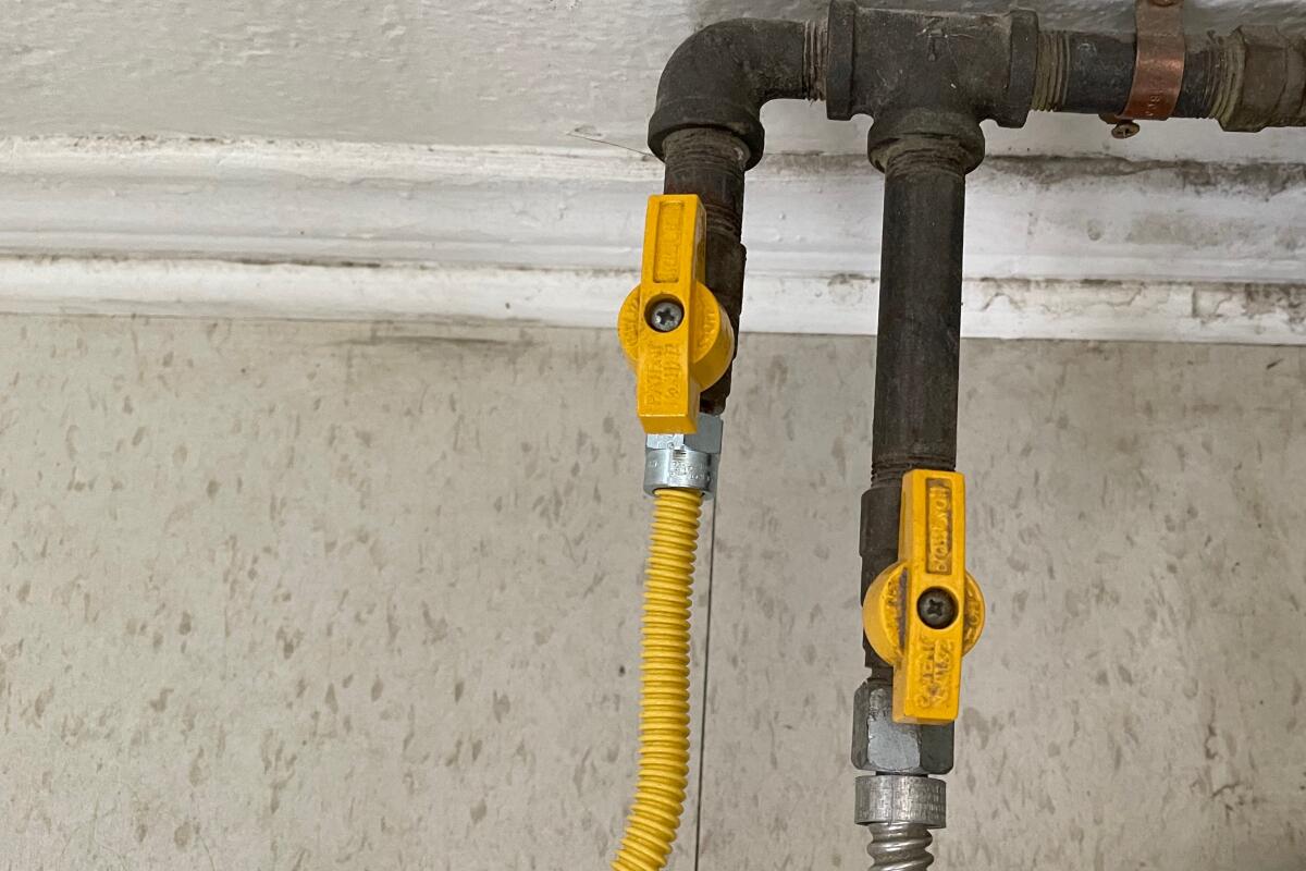 Gas lines with yellow shutoff valves