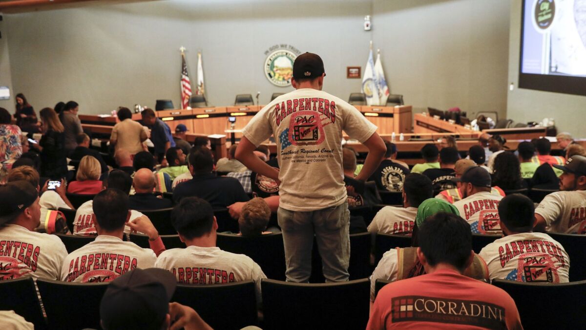 People wearing union shirts were out in large numbers during the Anaheim City Council meeting on June 19, as the council decided to put a controversial "living wage" measure on the November ballot.