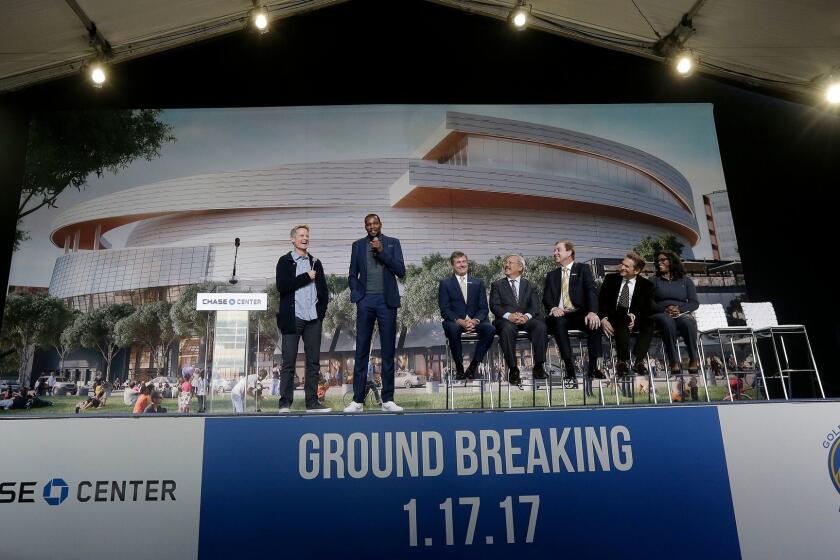 Golden State Warriors head coach Steve Kerr, left, and forward Kevin Durant, second from left, speak during a groundbreaking ceremony for the Chase Center in San Francisco on Jan. 17.