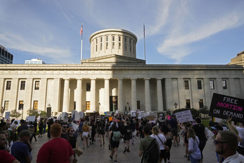 FILE - Protesters rally at the Ohio Statehouse in Columbus, Ohio, in support of abortion after the U.S. Supreme Court overturned Roe vs. Wade on June 24, 2022. A judge temporarily blocked Ohio’s ban on virtually all abortions, Wednesday, Sept. 14, 2022, again pausing a law that took effect after federal abortion protections were overturned by the Supreme Court in June. (Barbara J. Perenic /The Columbus Dispatch via AP, File)