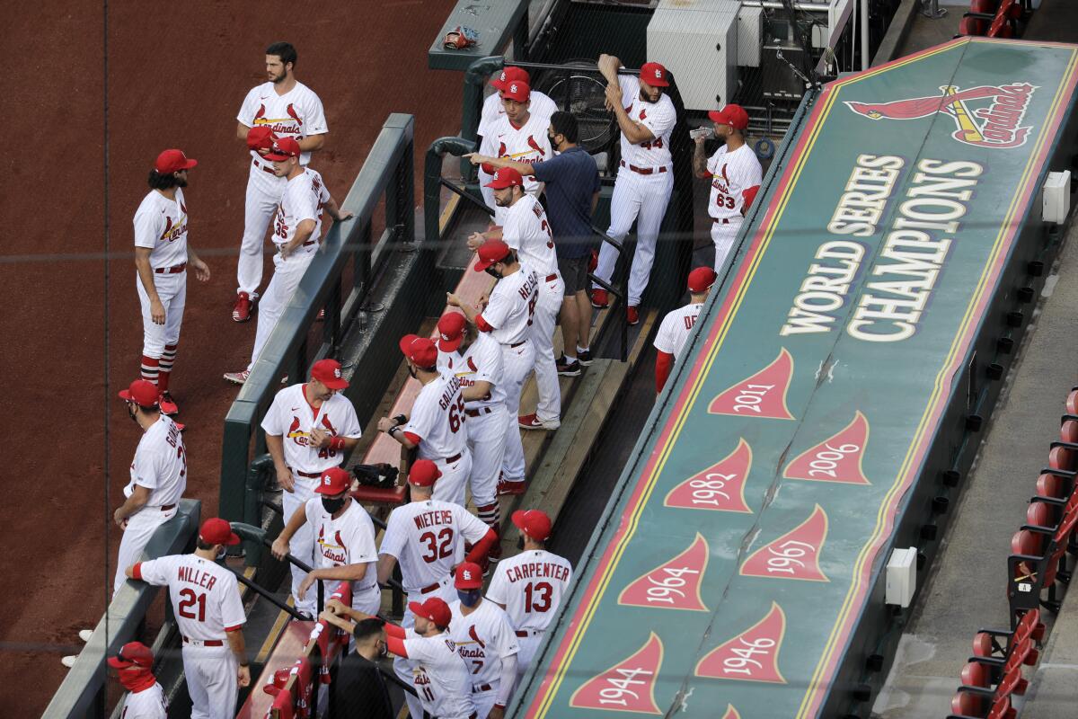 Members of the St. Louis Cardinals wait to be introduced before the start of a game against the Pittsburgh Pirates.