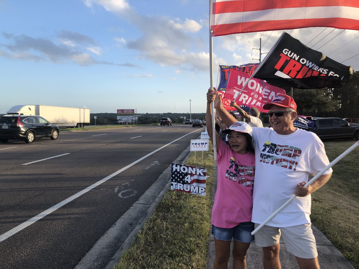 Vara Vail and her husband, Tom Vail, took part in a "Stop the Steal" rally in Minneola, Fla., on Thursday.