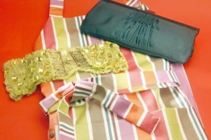 Oilcloth apron from Jean-Vier, $39.99; Hoss clutch from Camille DePedrini, $155; sparkly stretch belt from Angeli, $25.