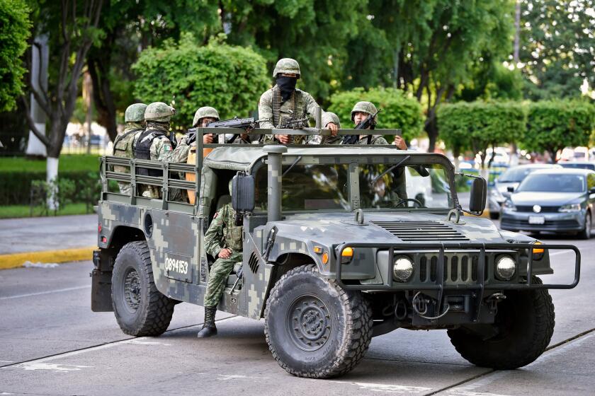 Soldiers patrol the surroundings of the government palace in Culiacan, Sinaloa state, Mexico, on October 18, 2019. - Mexico's president faced a firestorm of criticism Friday as his security forces confirmed they arrested kingpin Joaquin "El Chapo" Guzman's son, then released him when his cartel responded with an all-out gun battle. (Photo by ALFREDO ESTRELLA / AFP) (Photo by ALFREDO ESTRELLA/AFP via Getty Images)