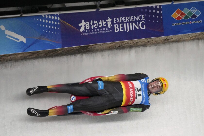 Johannes Ludwig of Germany competes during the men's race at the Luge World Cup, a test event for the 2022 Winter Olympics, at the Yanqing National Sliding Center in Beijing, Saturday, Nov. 20, 2021. (AP Photo/Mark Schiefelbein)