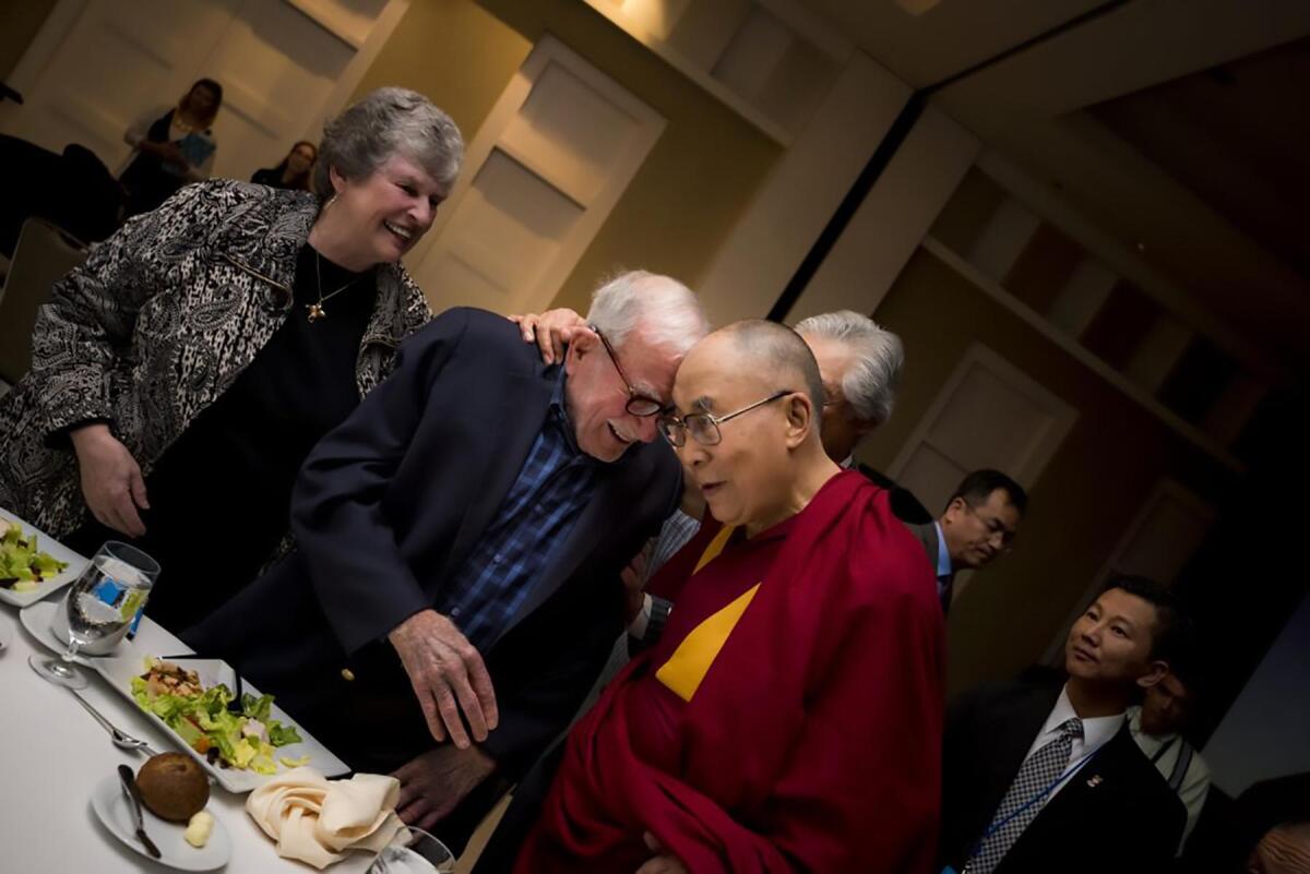 Walter Munk with Mary Coakley-Munk, his wife since 2011, and the Dalai Lama, who was UC San Diego’s 2017 commencement speaker.