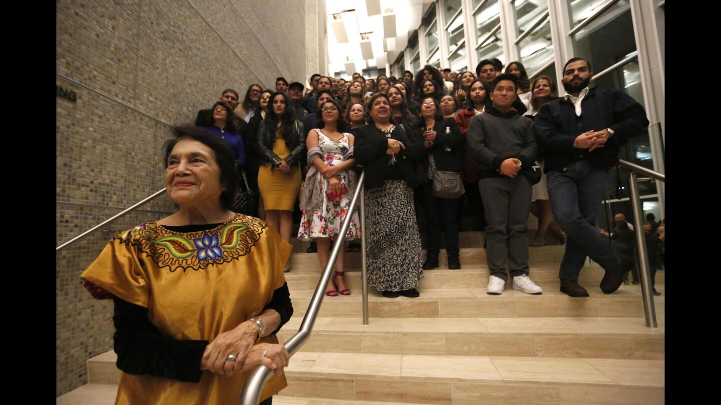 Activist Dolores Huerta, left, joins Dreamers, their families and allies Friday night after the opening performance of the mariachi opera "Cruzar la Cara de la Luna" (To Cross the Face of the Moon) at the Younes and Soraya Nazarian Center for the Performing Arts at Cal State Northridge.
