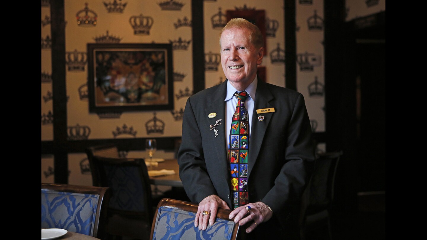 Tommy Martin stands in one of the dining rooms at Five Crowns restaurant in Newport Beach. Martin is celebrating 50 years with the restaurant this year. He’s gone from bartender to guest ambassador, which earned him the Rosalind Williams Service Excellence Award in 2011.