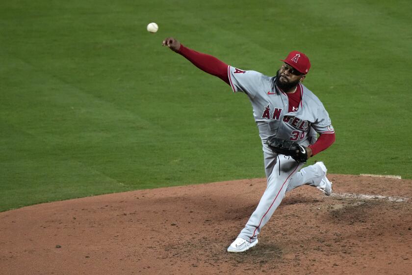 Los Angeles Angels starting pitcher Johnny Cueto throws during the fifth inning of a baseball game against the Kansas City Royals Wednesday, Aug. 21, 2024, in Kansas City, Mo. (AP Photo/Charlie Riedel)