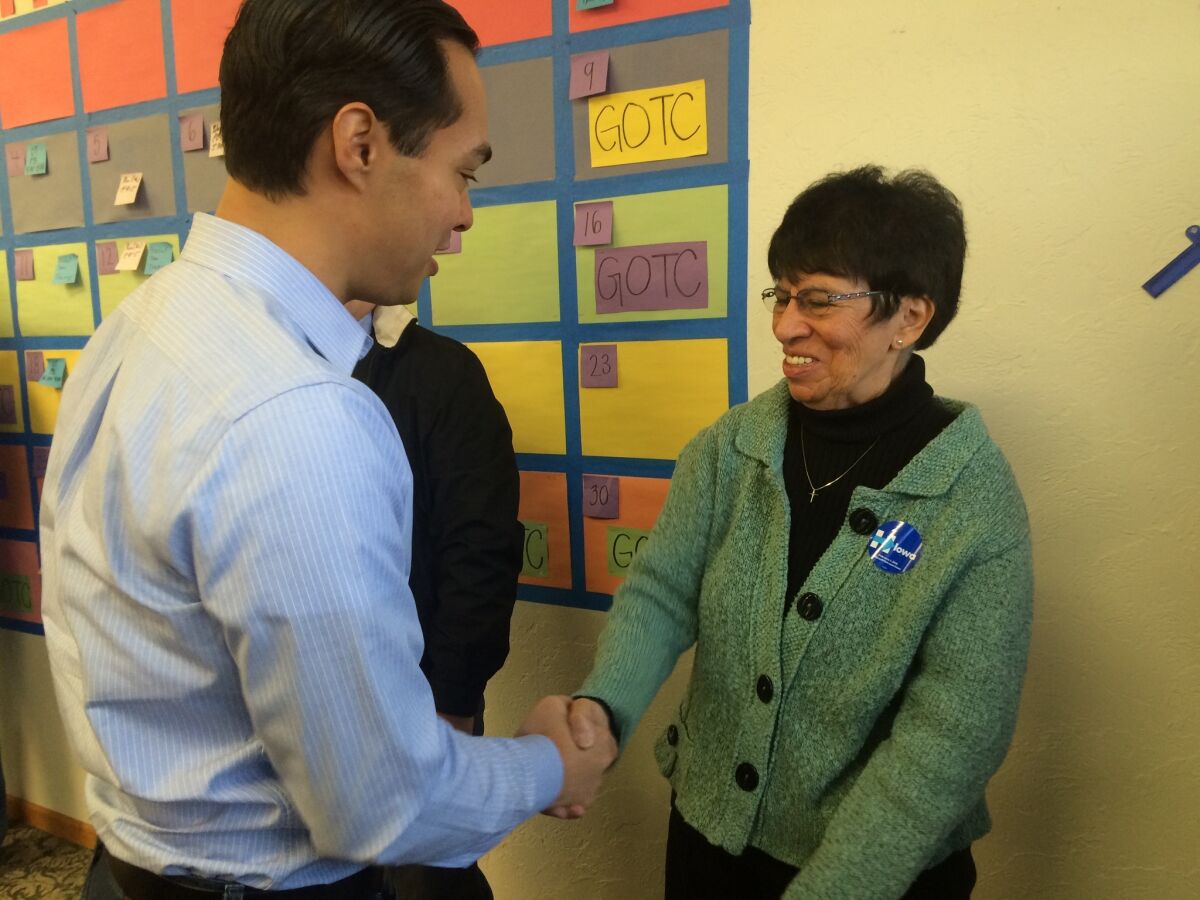 Julian Castro greets Sister Irene Munoz, a Hillary Clinton volunteer, at a campaign event in Ottumwa, Iowa, on Sunday.