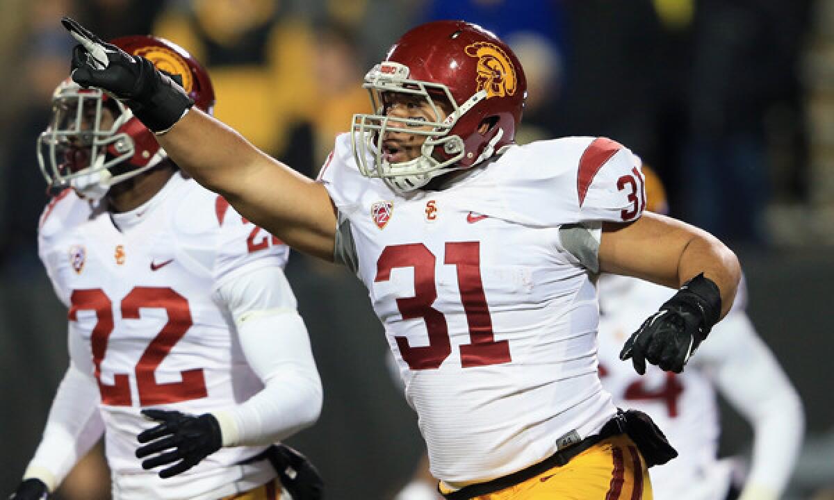 USC's Soma Vainuku celebrates after blocking a punt against Colorado last month. The Trojans will play Fresno State in the Las Vegas Bowl on Dec. 21.