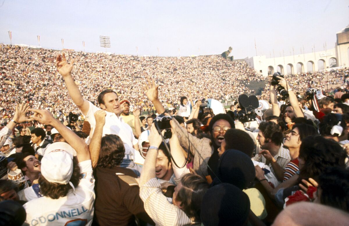 Miami Dolphins coach Don Shula is carried off the field.