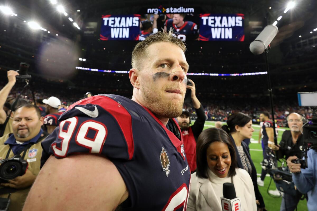 Houston defensive end J.J. Watt walks off the field following his team's overtime victory Jan. 4, 2020.