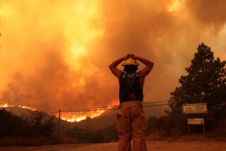 Orange County, California September 10, 2024-A resident stops to watch the Airport Fire burn near his home in the Santa Ana Mountains Tuesday. (Wally Skalij/Los Angeles Times)