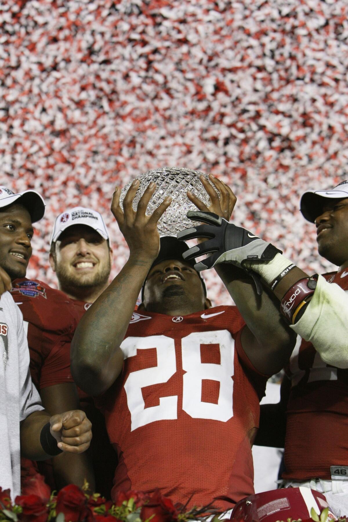Javier Arenas and his Alabama teammates celebrate the Crimson Tide's BCS national title in 2010. The BCS has offered fans and players plenty of memorable -- and controversial -- moments in its 16-year reign over college football.