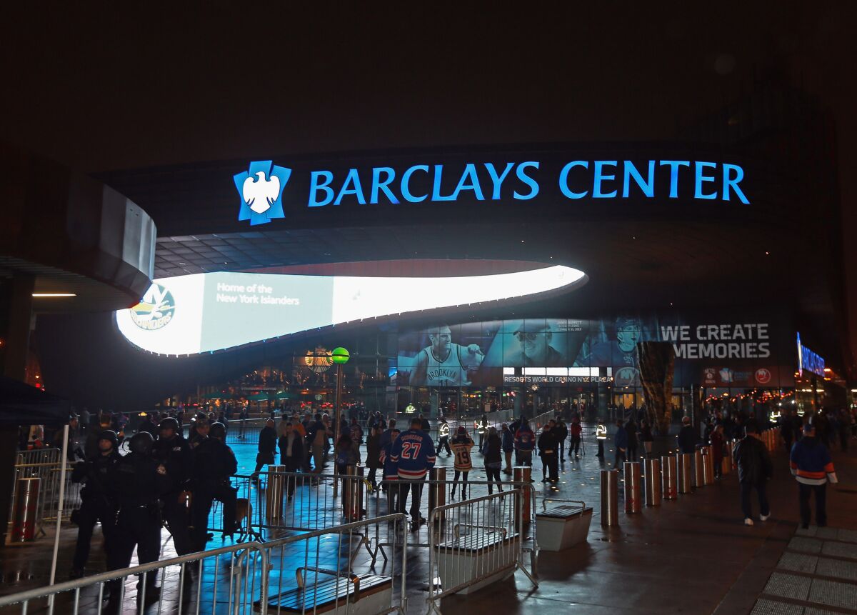 Patrons arrive at the Barclays Center for a Dec. 2 game between the New York Islanders and the New York Rangers in Brooklyn, N.Y.