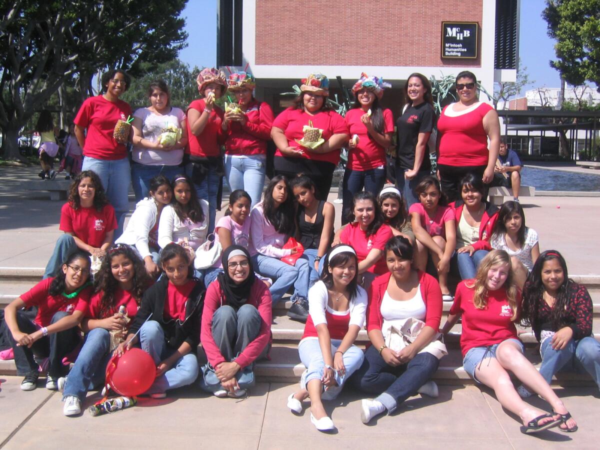 Girls with the College Bound Girls Inc. program tour a college campus.