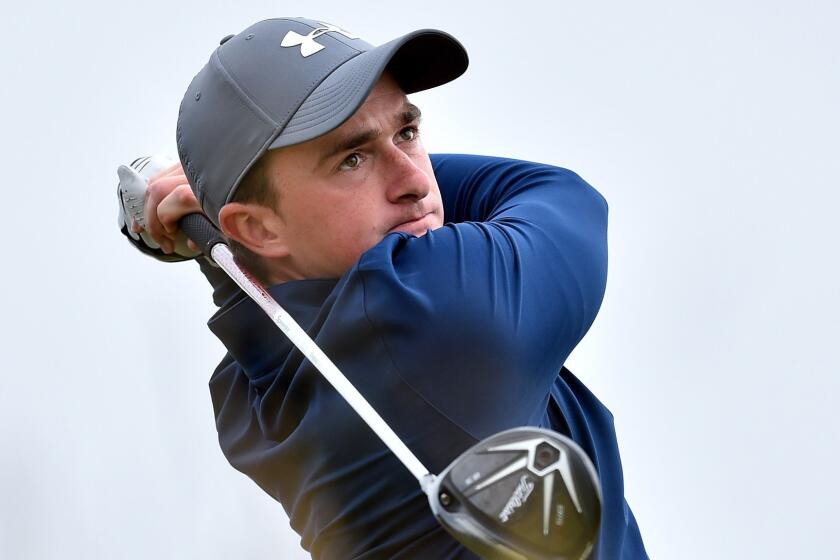 Amateur Paul Dunne of Ireland watches his drive from the sixth tee during the third round of the British Open at St. Andrews, Scotland, on Sunday.